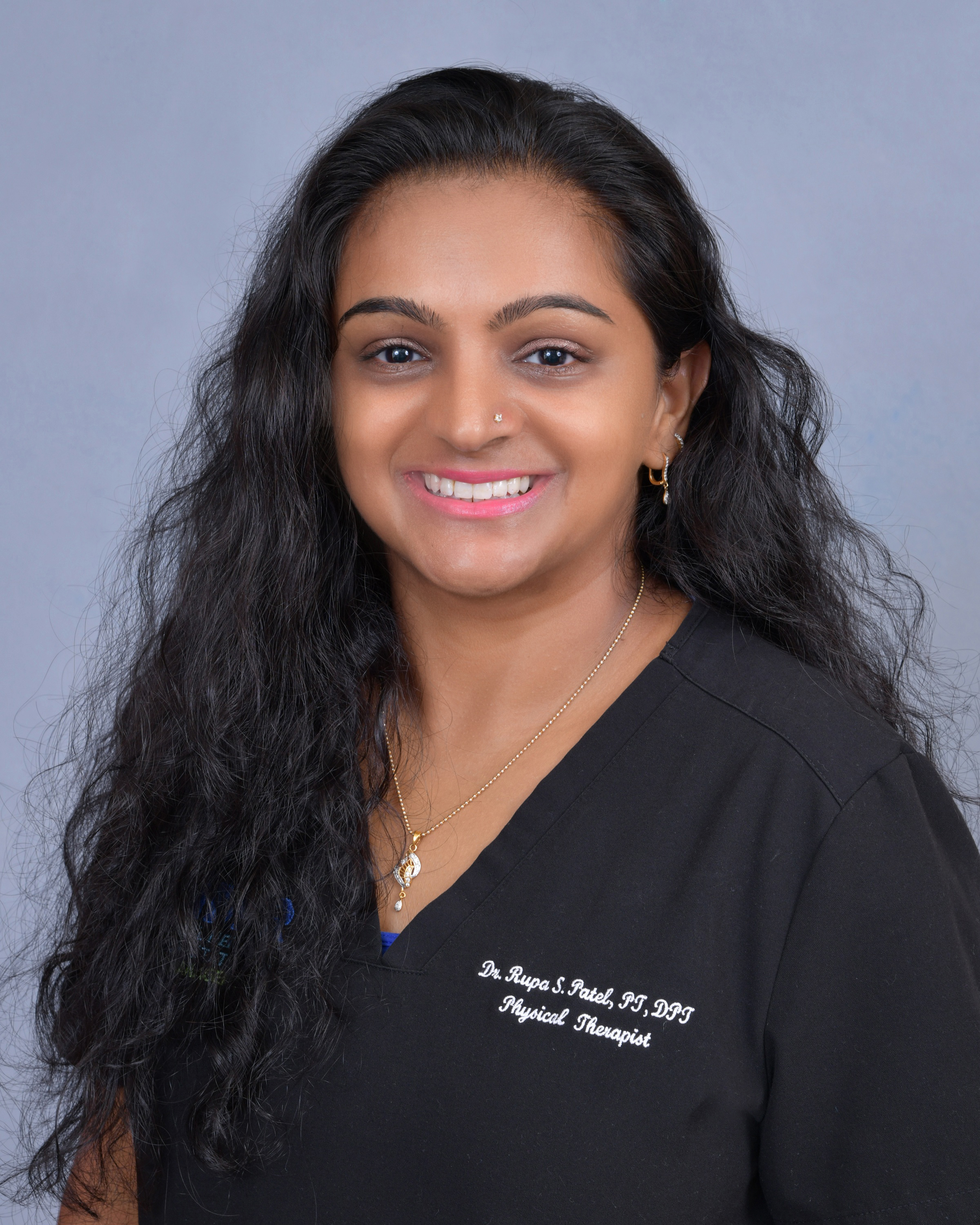 Dr. Rupa Patel performing physical therapy